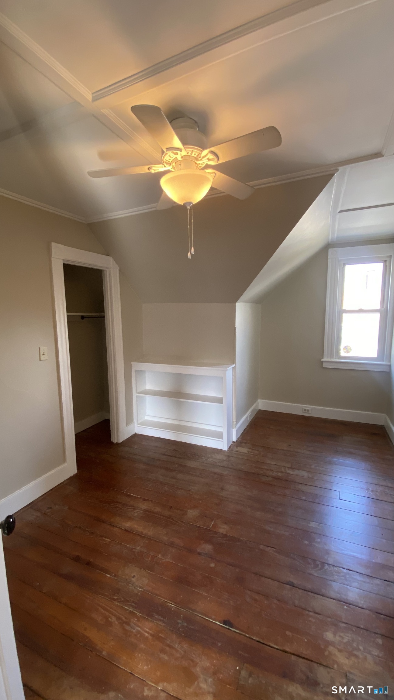 88 Belleview Avenue Torrington, CT 06790 - Photo 11 of 26 a view of empty room with window and wooden floor