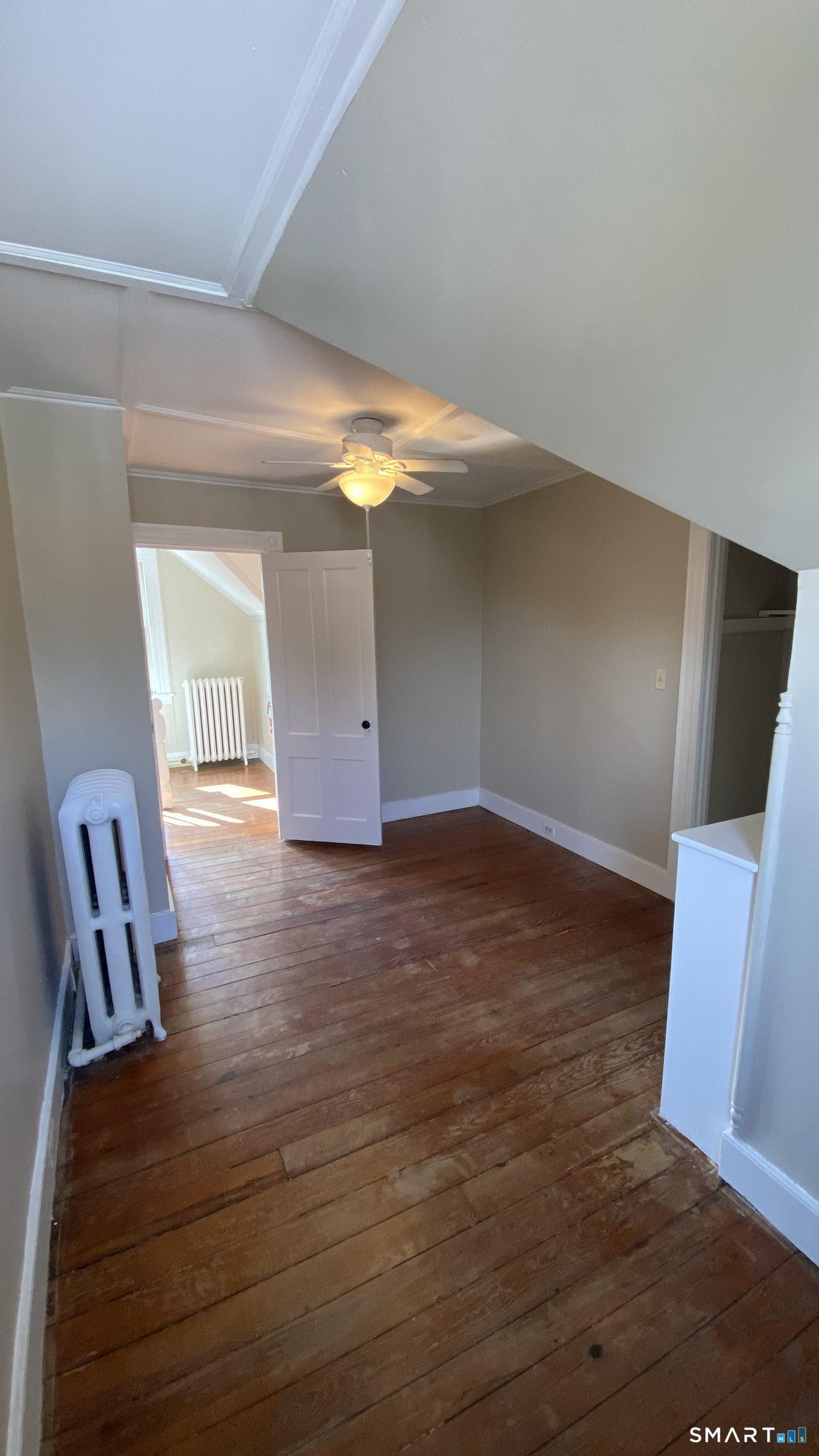 88 Belleview Avenue Torrington, CT 06790 - Photo 14 of 26 a view of an empty room with wooden floor and a window