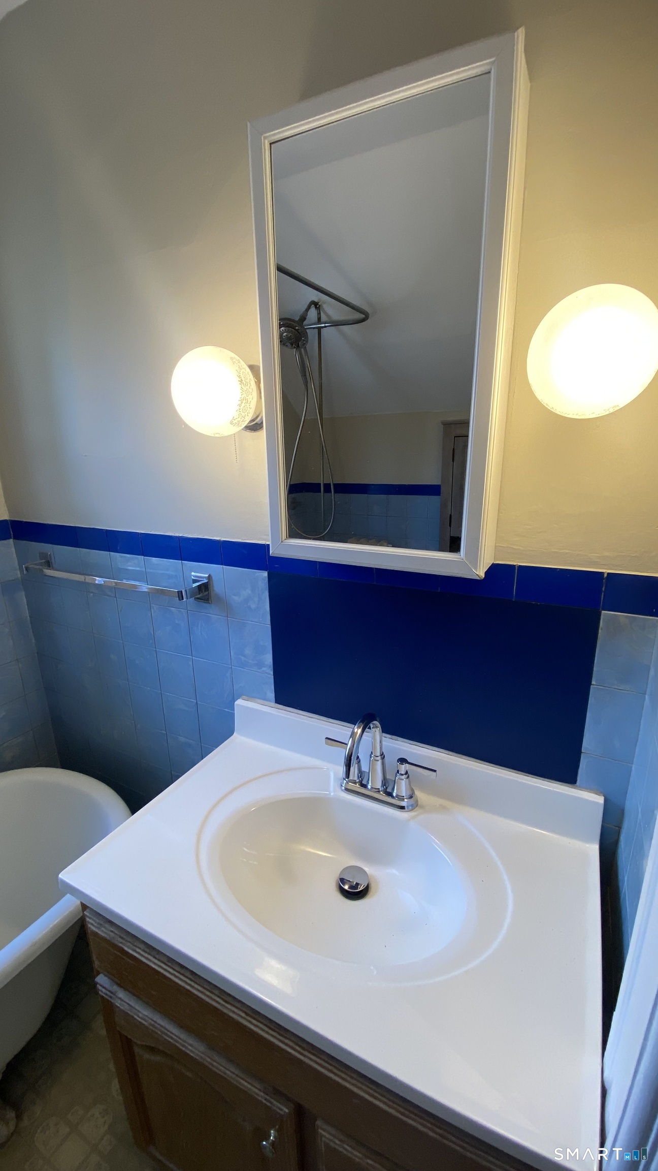 88 Belleview Avenue Torrington, CT 06790 - Photo 16 of 26 a bathroom with a sink and a mirror