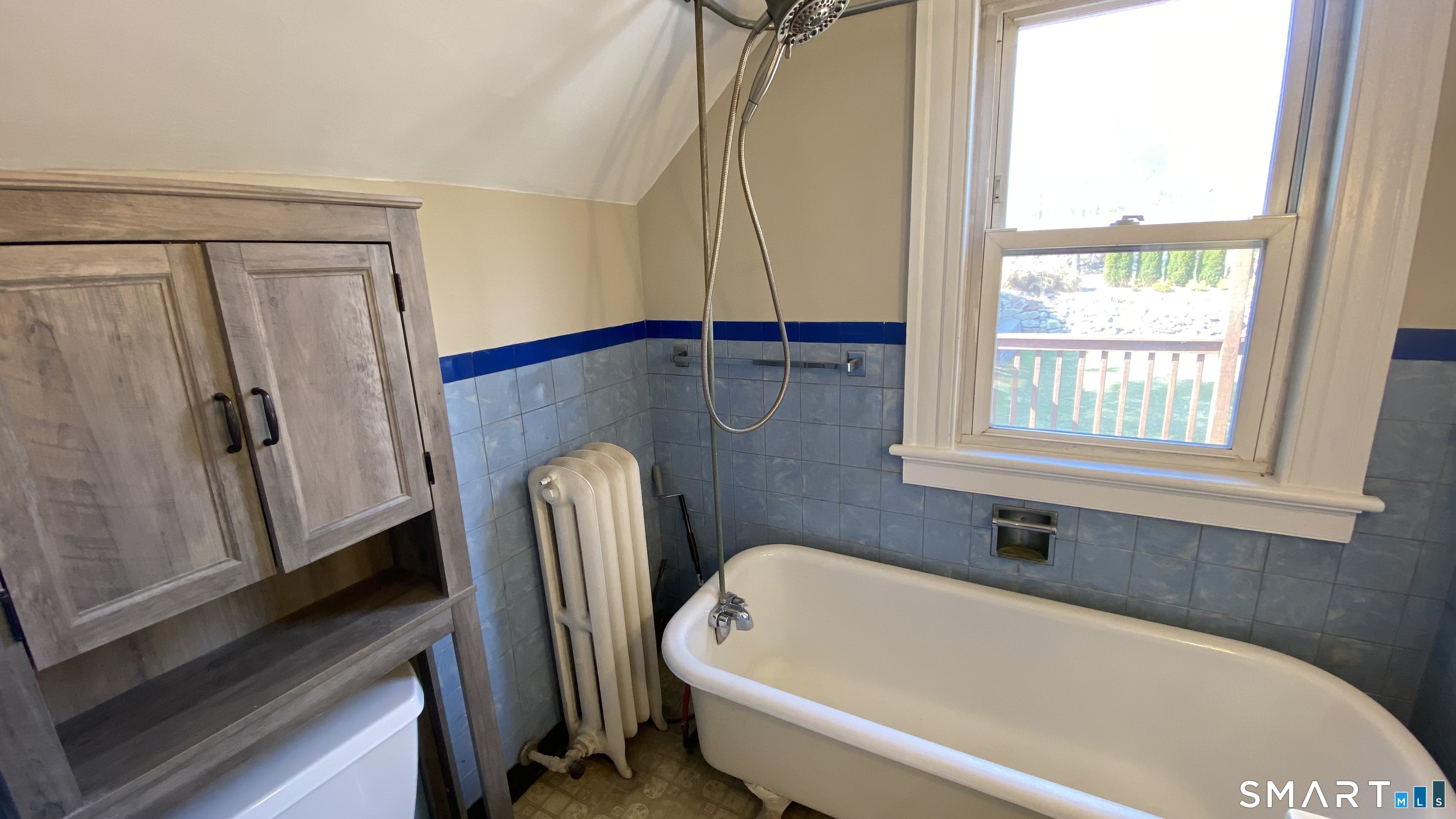 88 Belleview Avenue Torrington, CT 06790 - Photo 18 of 26 a bathroom with a tub and a window
