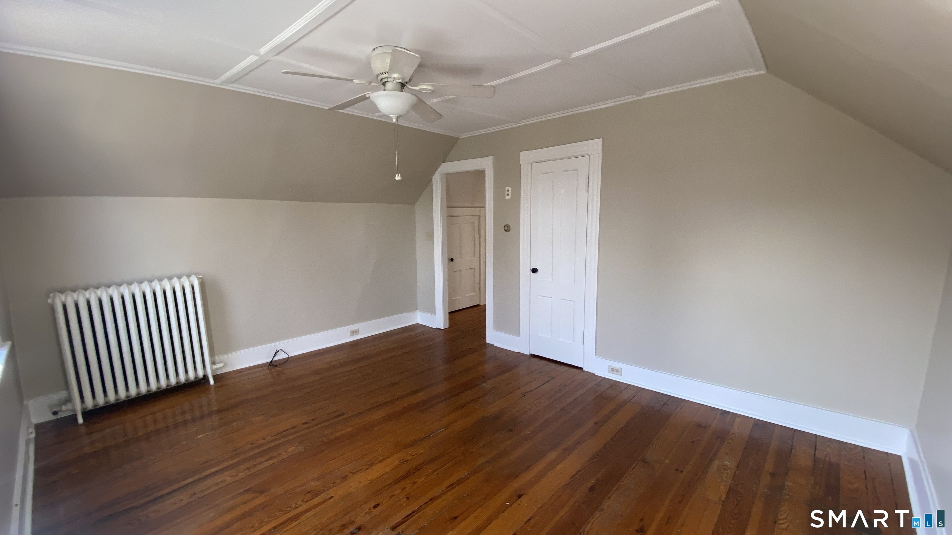 88 Belleview Avenue Torrington, CT 06790 - Photo 9 of 26 a view of an empty room with wooden floor