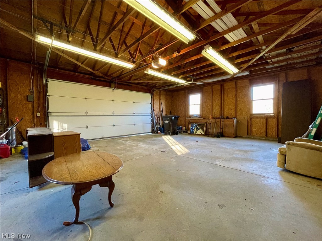 5845 Ridge Road Cortland, OH 44410 - Photo 9 of 29 Garage featuring a garage door opener