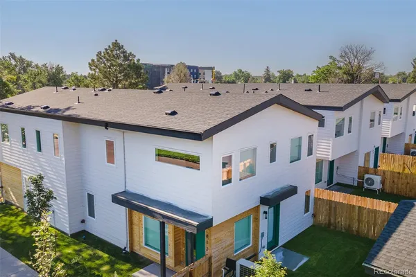 a aerial view of a house with a yard