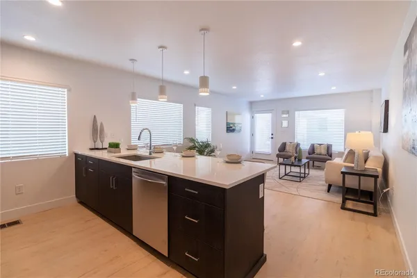 a large kitchen with lots of counter space and a sink