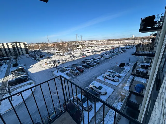 a view of a balcony with chairs