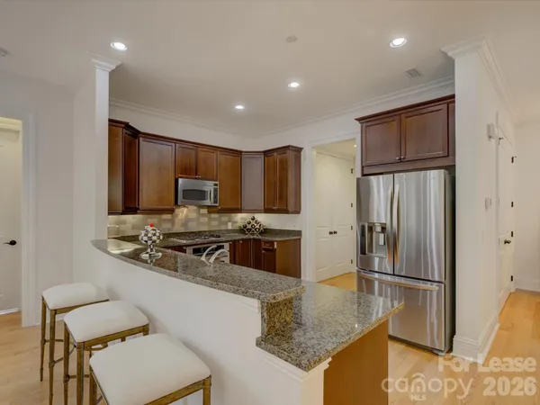 a kitchen with a sink and a refrigerator
