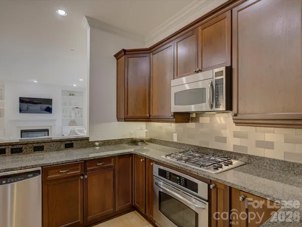 a kitchen with a sink stove and microwave