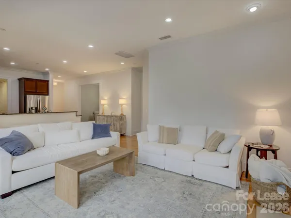 a balcony with furniture and a window