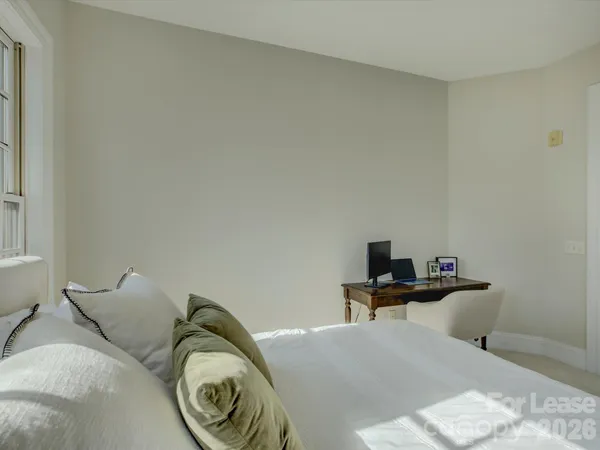 a bedroom with a bed and tv