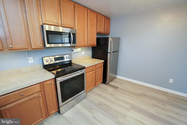 a kitchen with a sink and a microwave