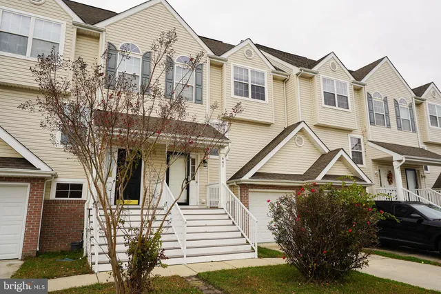 a view of a white building among the street