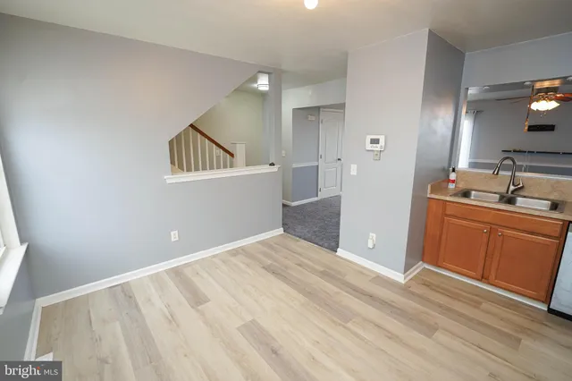 a view of a kitchen with a sink dishwasher and a refrigerator