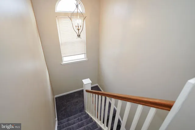a view of a hallway with windows