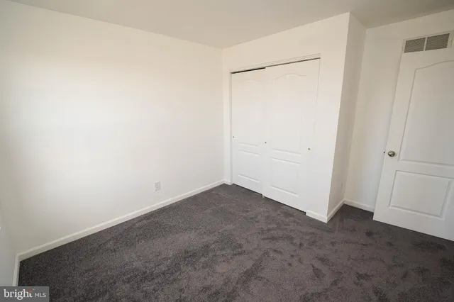 a bathroom with a toilet and a bathtub