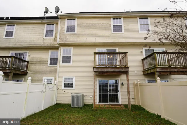 a view of an house with backyard space and garden