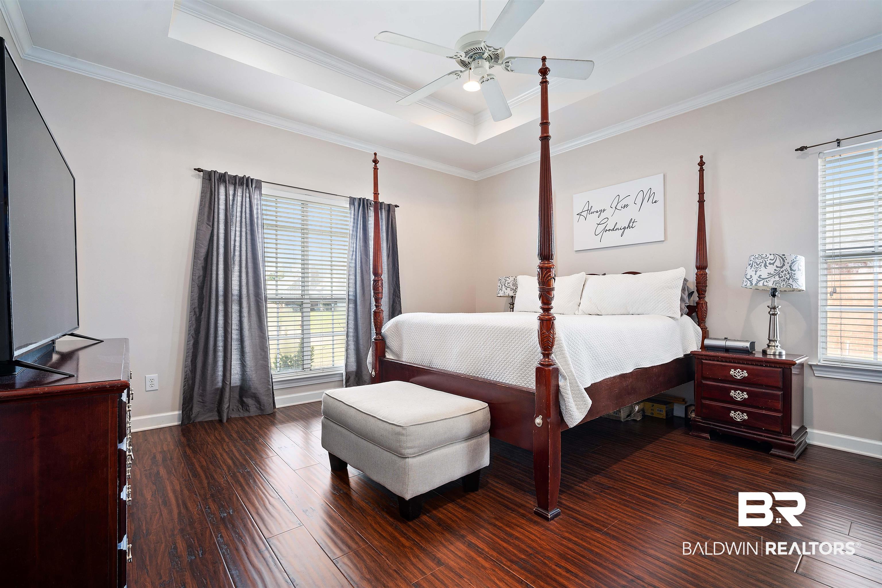 9552 White Castle Road Mobile, AL 36695 - Photo 16 of 31 Bedroom featuring wood finished floors, a tray ceiling, and ornamental molding