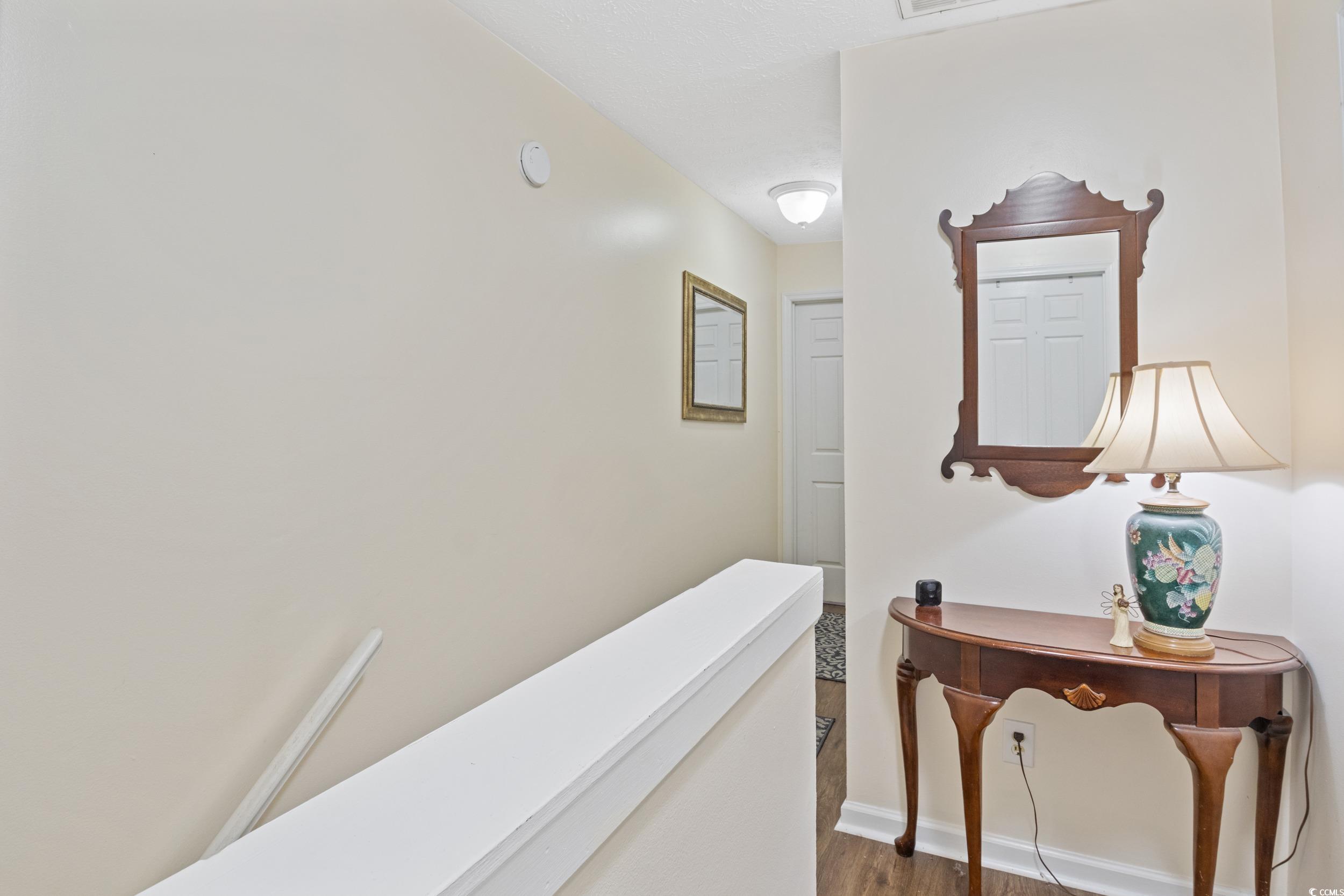 830 44th Avenue North, Unit S4 Myrtle Beach, SC 29577 - Photo 11 of 31 Hall featuring wood finished floors and baseboards