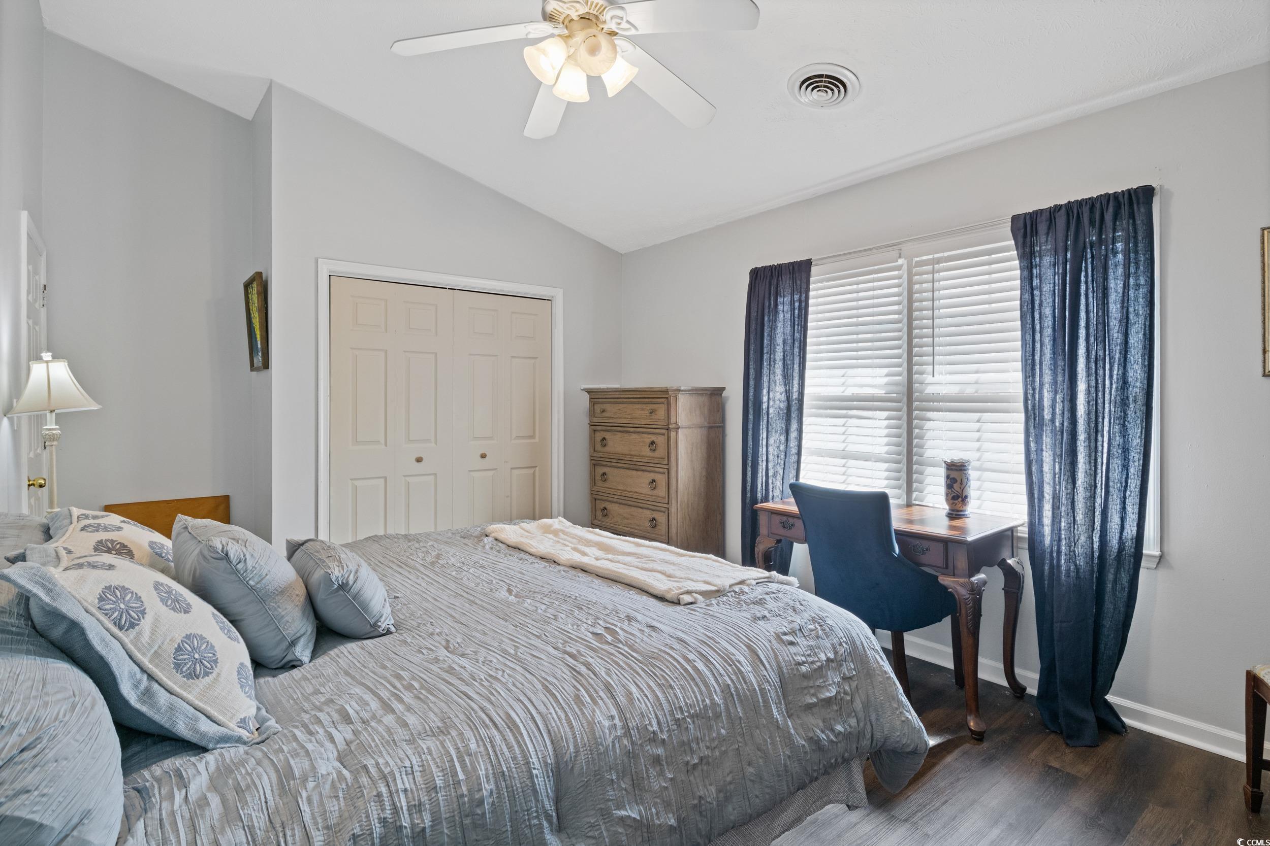 830 44th Avenue North, Unit S4 Myrtle Beach, SC 29577 - Photo 18 of 31 Bedroom featuring lofted ceiling, dark wood-type flooring, a closet, and a ceiling fan