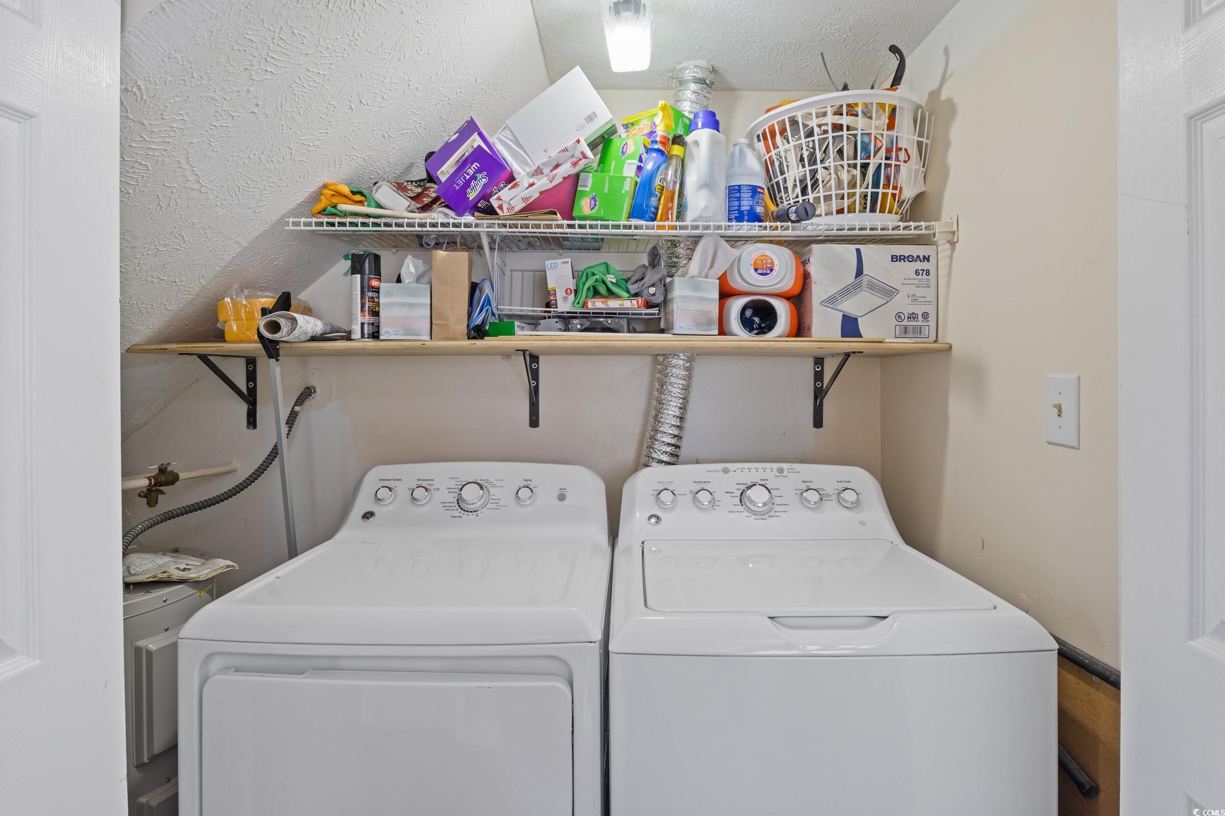 830 44th Avenue North, Unit S4 Myrtle Beach, SC 29577 - Photo 20 of 31 Washroom with washing machine and clothes dryer and a textured wall