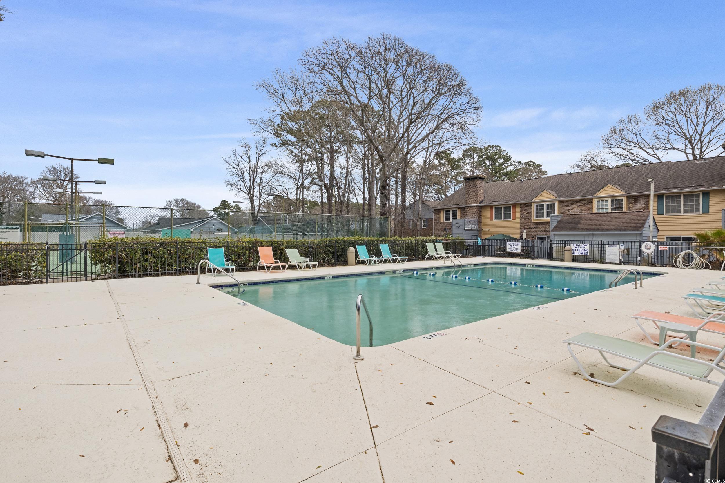 830 44th Avenue North, Unit S4 Myrtle Beach, SC 29577 - Photo 22 of 31 Community pool with a patio