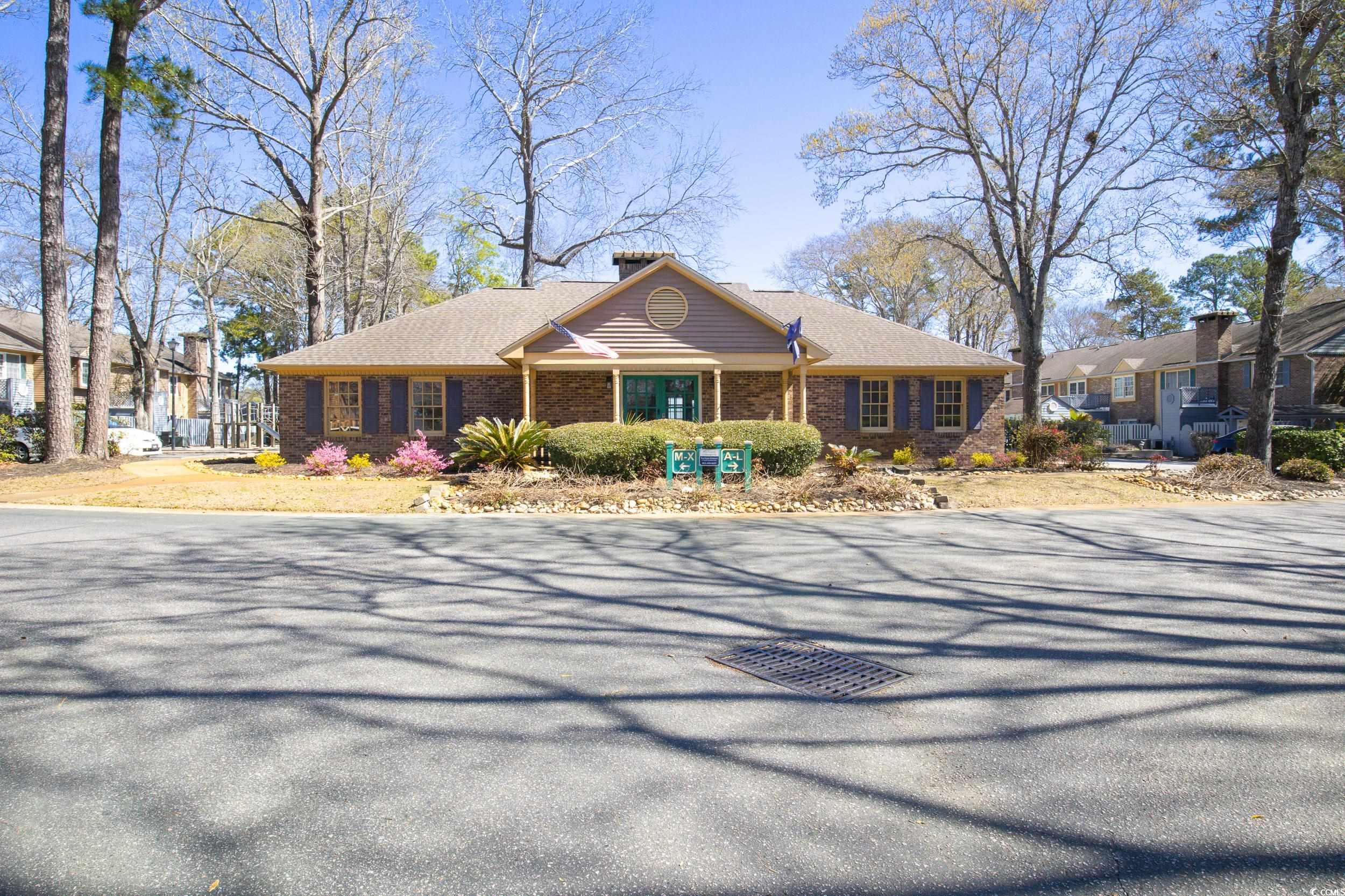 830 44th Avenue North, Unit S4 Myrtle Beach, SC 29577 - Photo 23 of 31 Single story home featuring brick siding and a chimney