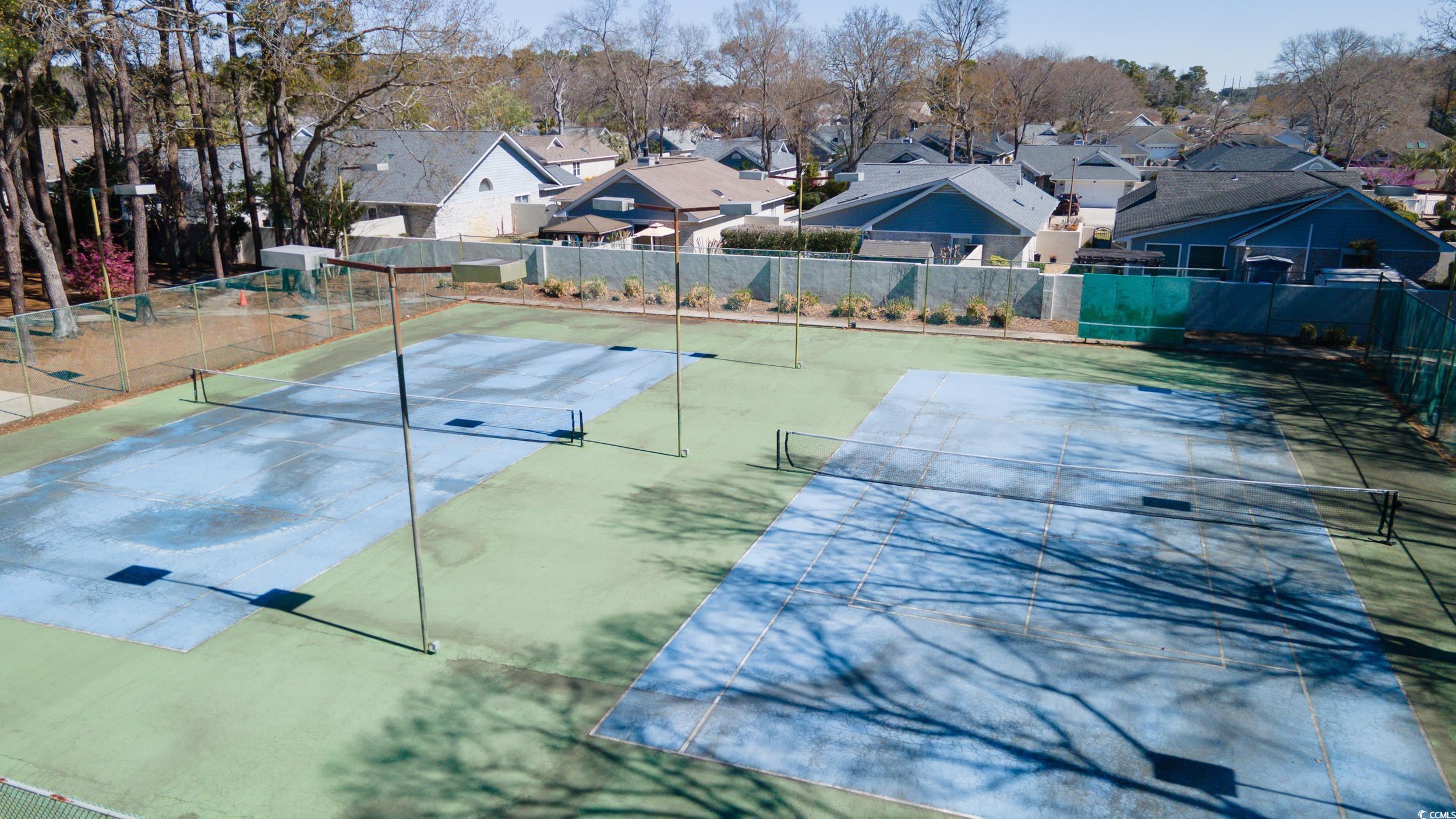 830 44th Avenue North, Unit S4 Myrtle Beach, SC 29577 - Photo 24 of 31 View of pool featuring a tennis court, a residential view, and a patio