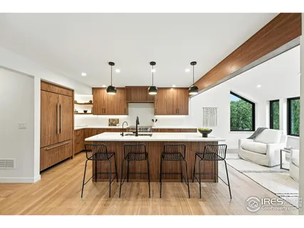 a open kitchen with a table and chairs
