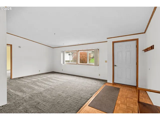 a view of an empty room with a window