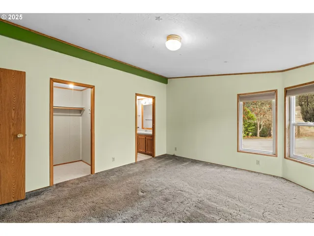 a view of an empty room and window