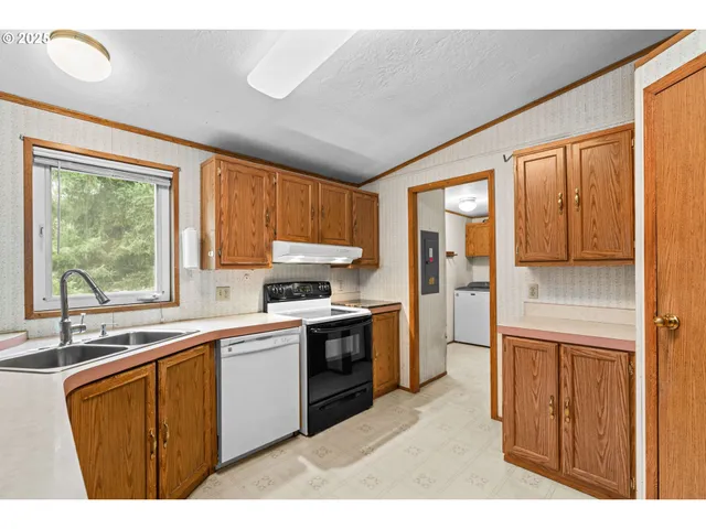 a kitchen with a sink stove and refrigerator