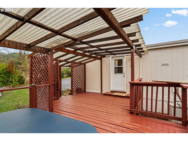 a view of a porch with wooden floor