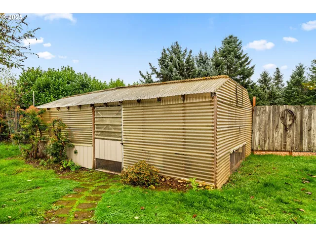 a view of a backyard with plants and a garden