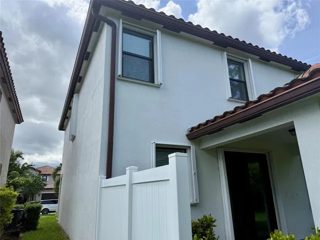 a view of an house with backyard space and garden
