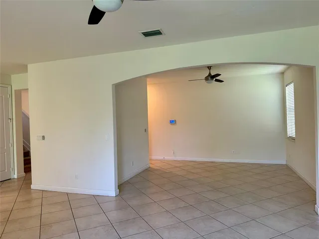 a view of a hallway to rooms