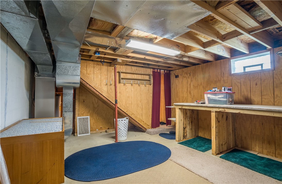 1319 Perry Road Cable, OH 43009 - Photo 30 of 44 This versatile basement space features exposed ductwork and an unfinished ceiling, offering potential for various uses.