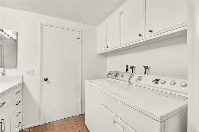 a view of a livingroom with wooden floor and stairs