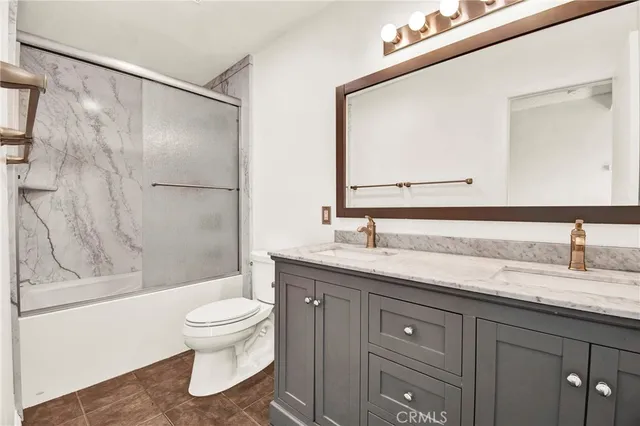 a spacious bathroom with a granite countertop sink a mirror and a