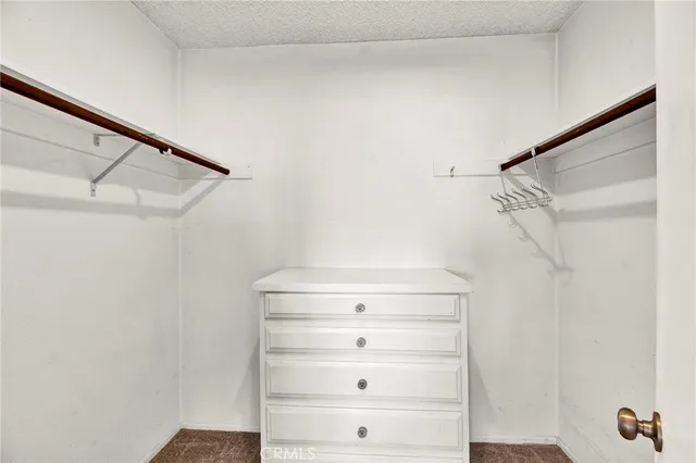 a front view of a house with patio and garden