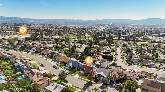 an aerial view of a residential apartment building with a yard