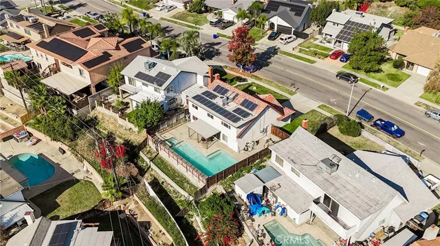 an aerial view of houses with yard
