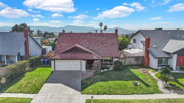 a living room with furniture fireplace and a table