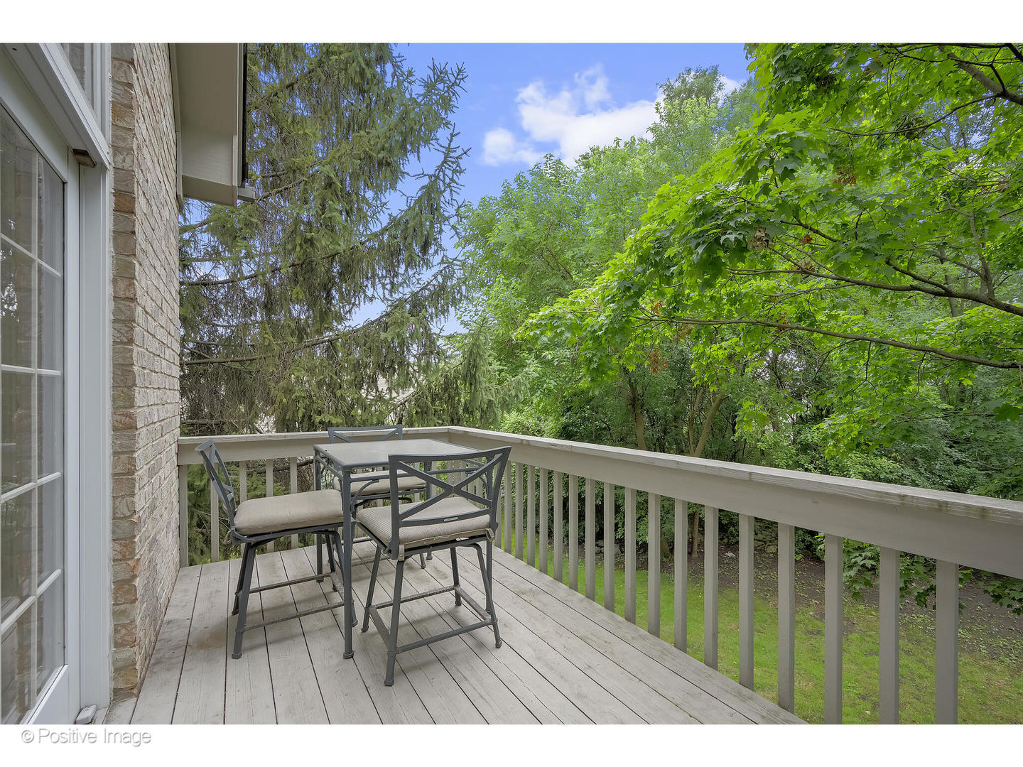 13 Tartan Ridge Road Burr Ridge, IL 60527 - Photo 16 of 37 a balcony with wooden floor table and chairs