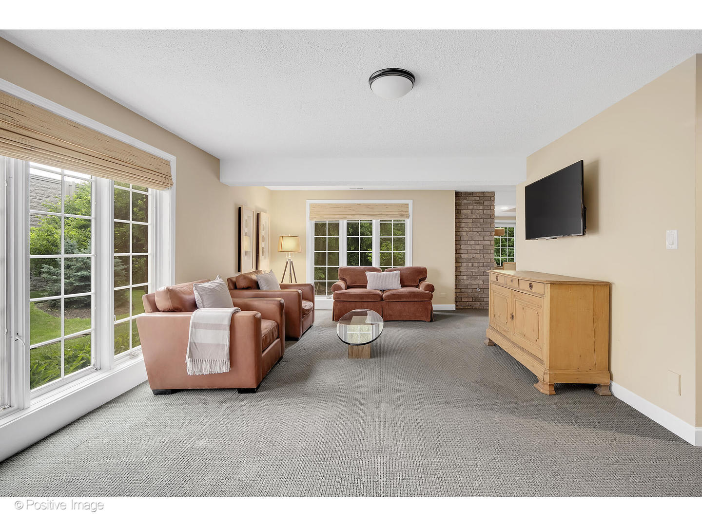 13 Tartan Ridge Road Burr Ridge, IL 60527 - Photo 30 of 37 a living room with furniture and a flat screen tv
