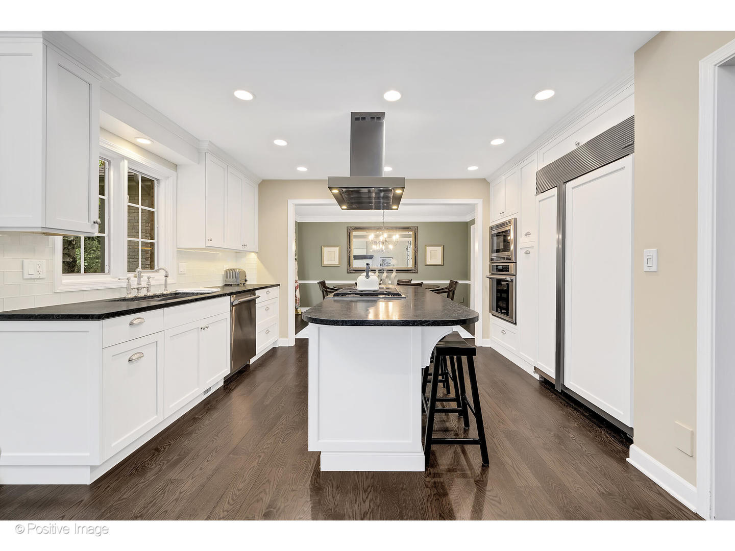 13 Tartan Ridge Road Burr Ridge, IL 60527 - Photo 9 of 37 a open kitchen with stainless steel appliances kitchen island a sink dishwasher a stove and white cabinets with wooden floor