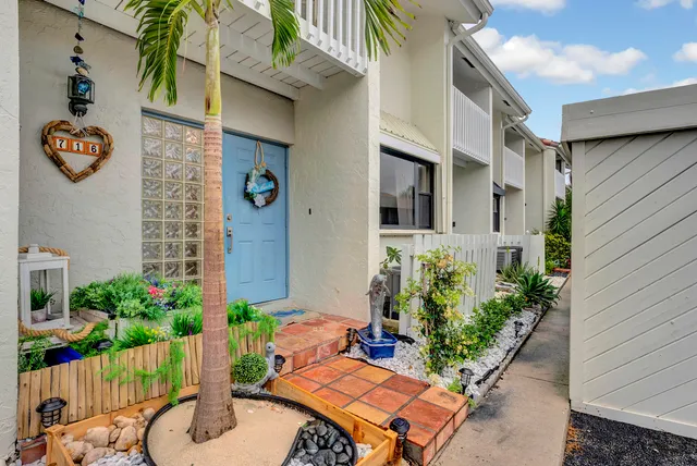 a backyard of a house with outdoor seating