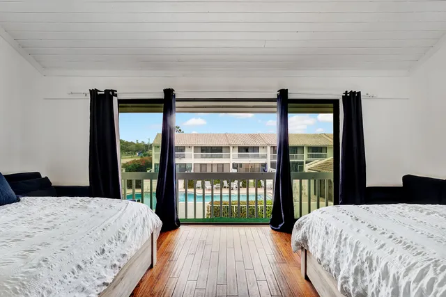 a hallway with a table and a fireplace