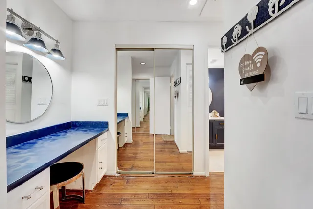a bathroom with a toilet a sink and a mirror
