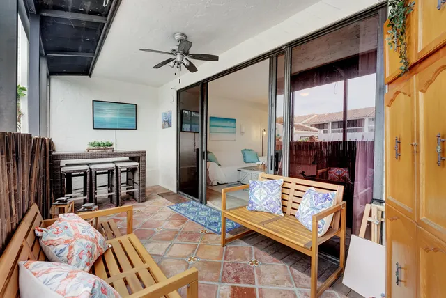 a wooden bench sitting in front of a building