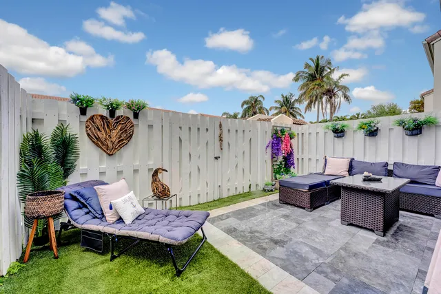 a view of a porch with wooden floor