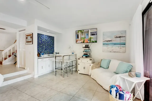 a living room with furniture and a table